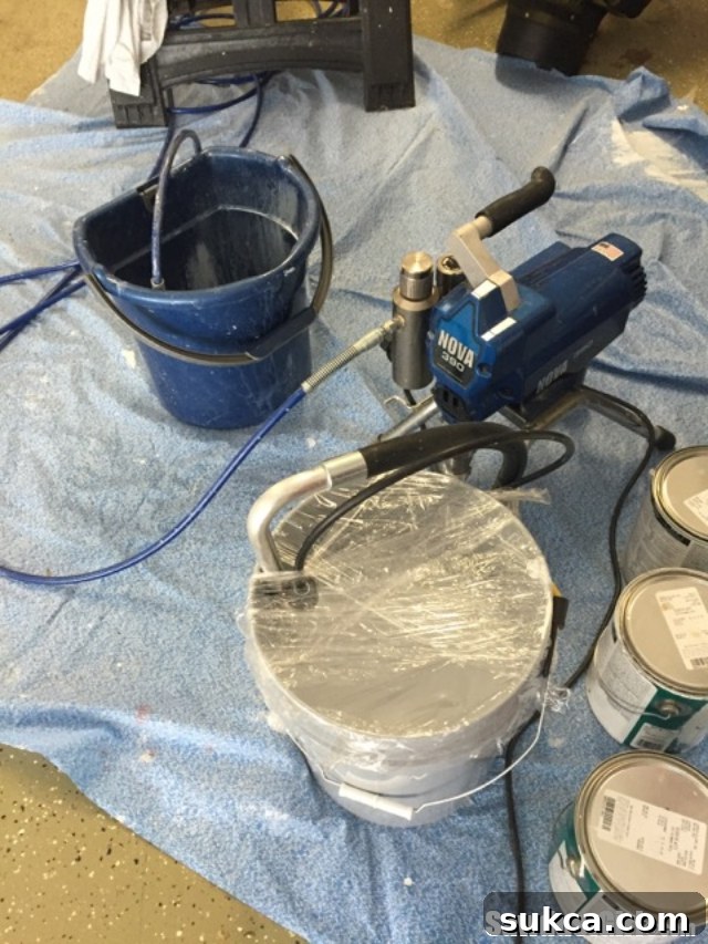 Inside view of a spray shelter designed for painting cabinet doors, highlighting the spacious and protected environment.
