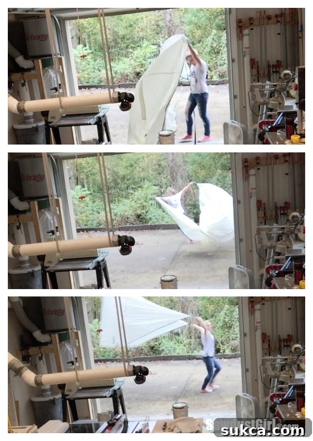 Detailed view of assembling a portable spray shelter, showing the frame structure and fabric attachment for a secure setup.