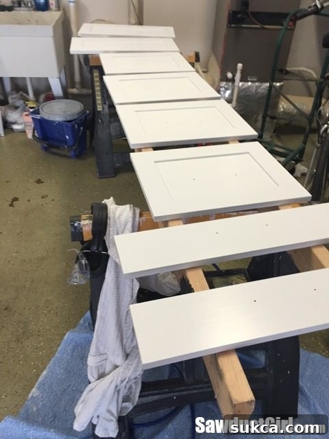 Drying Cabinet Doors Cabinet doors drying overnight after the first coat of paint, laid flat for optimal leveling