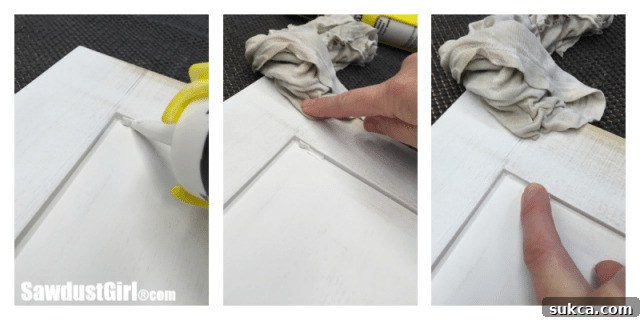 Caulking Seams Applying caulk to the seams between the cabinet door frame and panel for a professional, crack-free finish