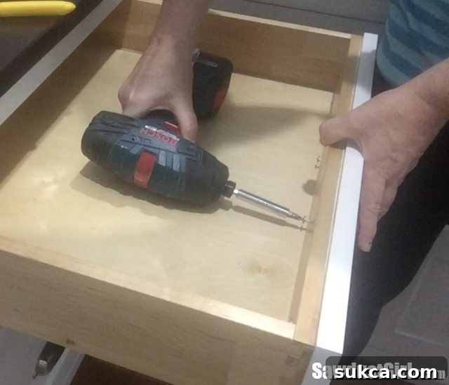 Installing drawer pulls with care to avoid stripping screws or damaging material