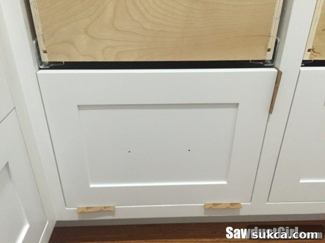 Using shims and spacers to align the applied drawer front