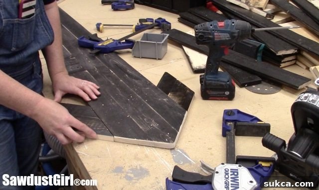 Adding Wings to Wood Arrow Attaching scrap wood 'wings' to the arrowhead of a large DIY arrow