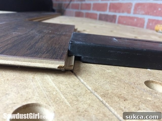 Using a tapping block for laminate flooring installation