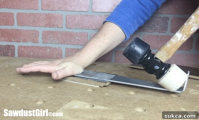 Using a pull bar to install the last rows of Pergo laminate flooring