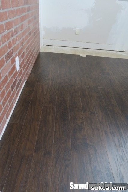 Finished Pergo laminate flooring in the loft craft room
