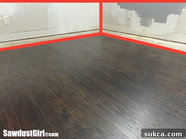 Spacious loft craft room with newly installed Pergo laminate flooring