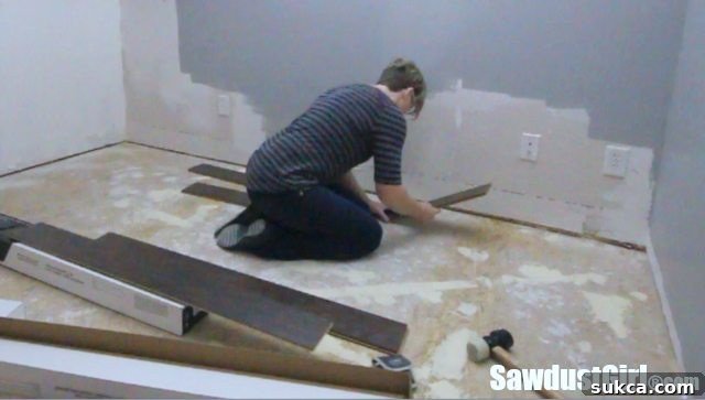 Installing the first row of Pergo laminate flooring