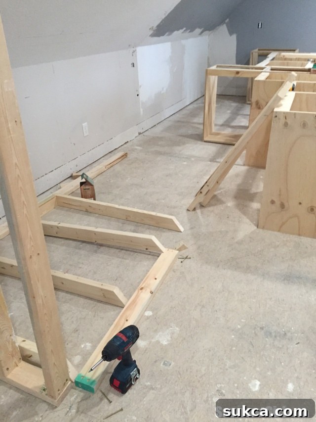 Angled Ceiling Framing Precisely cutting vertical studs at a 40-degree angle to match the sloped ceiling in a craft room