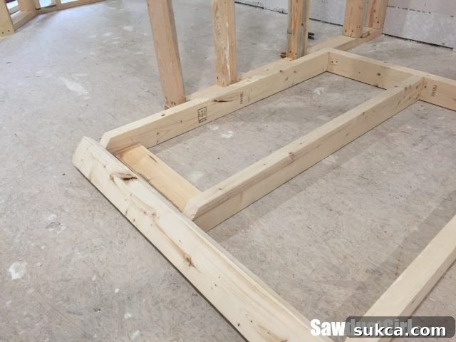 Wall Framing Details Framing a section of the false wall, showing consistent stud spacing for cabinet support