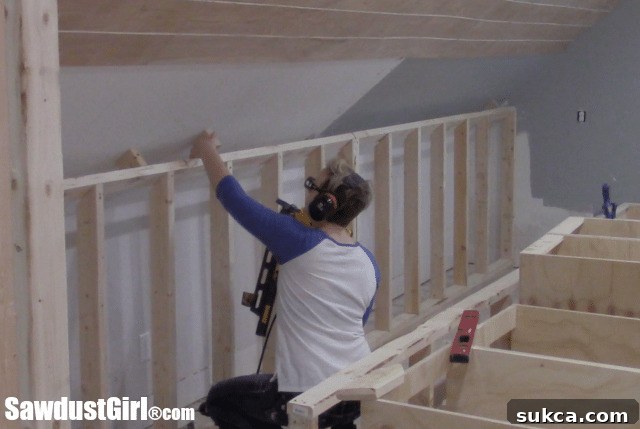 Securing the extended wall with 2x4 pieces for enhanced stability