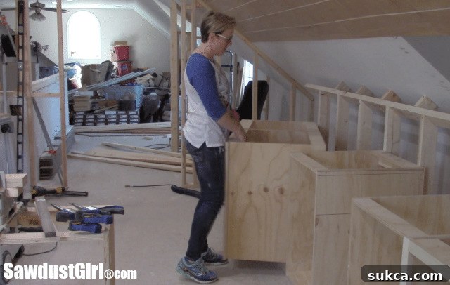 The newly installed base cabinets define the layout of the craft room