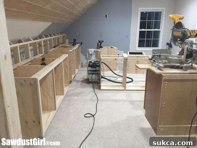Base cabinets are securely anchored to the wall, ready for the next phase
