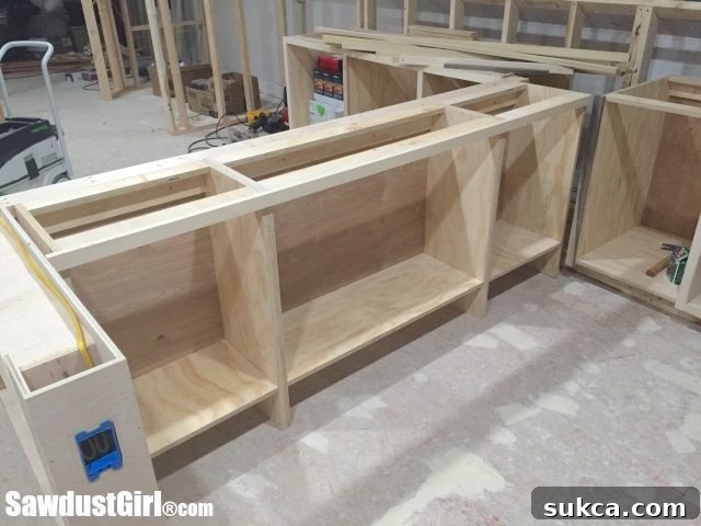 Custom Craft Island Cabinets with Interior Storage Solutions and Footrest