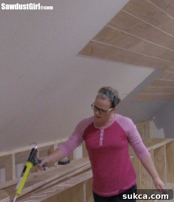 Attaching planks with adhesive and nails Adhesive and nails used for plywood ceiling planks
