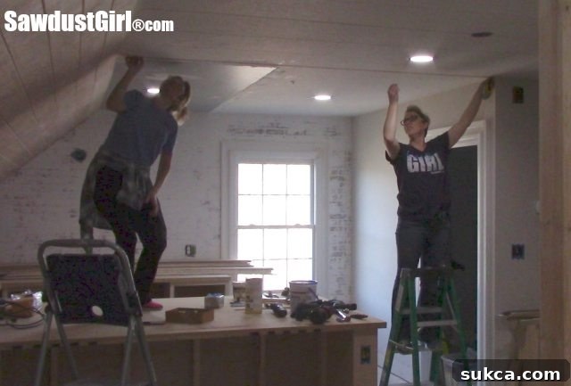 Snapping chalk lines for ceiling joists Using a chalk line to mark joists for plywood ceiling