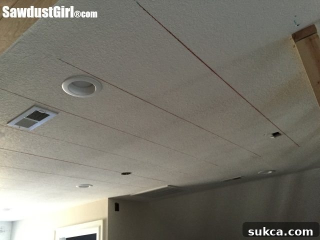 Chalk lines guiding installation Ceiling marked with chalk lines for plank installation