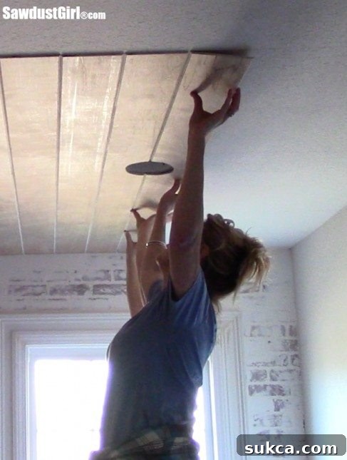 Plywood ceiling before painting Unpainted plywood plank ceiling installed in sections