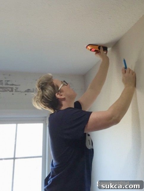 Comprehensive joist marking in studio Marked ceiling joist locations on a slanted ceiling