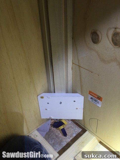 The faceframe filler securely installed, highlighting the perfect fit of the custom support block