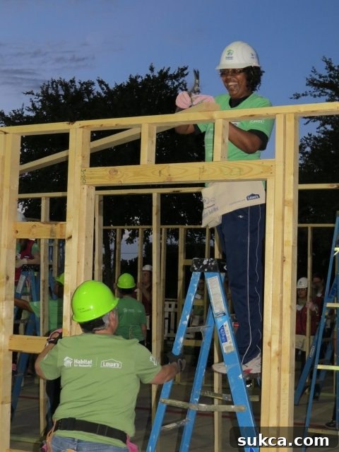 Happy volunteers smiling after a successful day of building