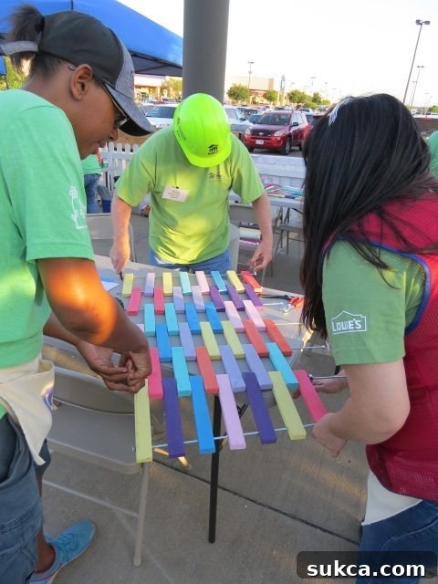 Volunteers assembling wooden door mats at a Women Build event