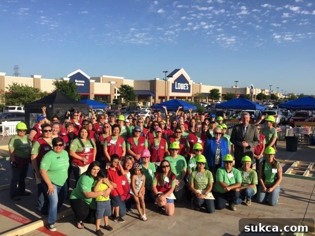 A large group of enthusiastic volunteers at the Habitat for Humanity build