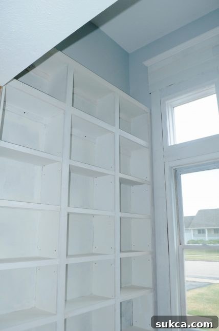 Installing custom MDF casings to large windows, enhancing architectural detail