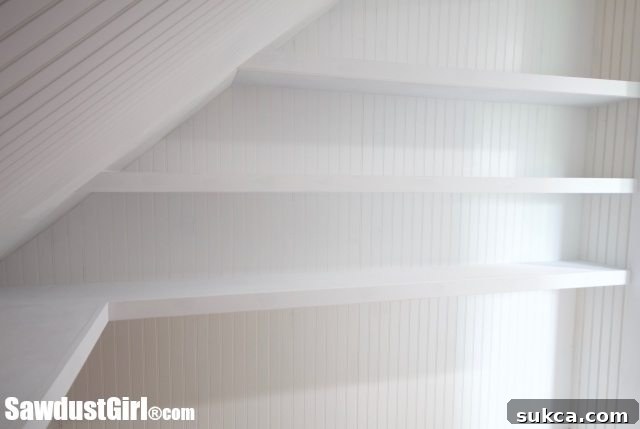 Finished white wall shelves in a renovated closet