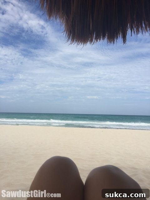 Cancun Vacation A serene panoramic beach view from Cancun, illustrating the parents' relaxing vacation experience.
