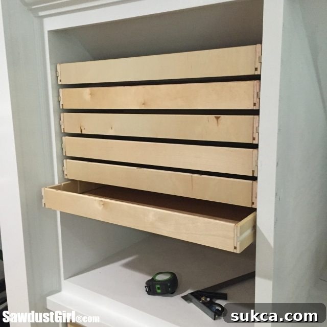 Finished wood drawer runners with drawers smoothly in place