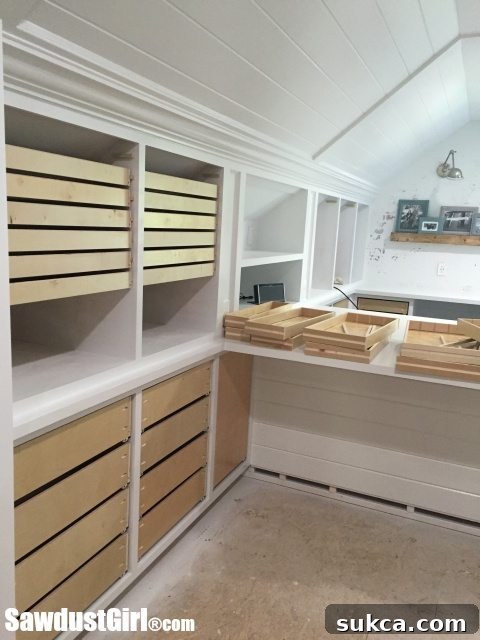 Studio apothecary drawers with custom wood runners for storage
