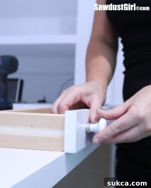 Close-up of DIY Map Drawer Fronts with simple ceramic knobs