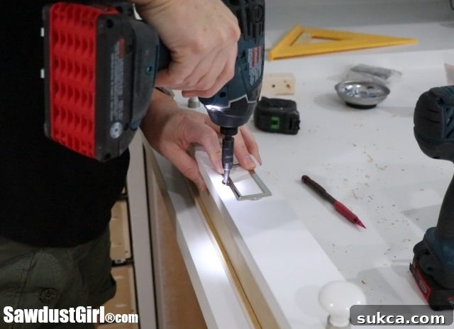 Installing label holders on DIY Map Drawers for organization