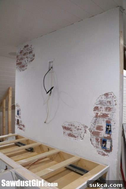 Stunning Faux Chipped Plaster Brick Wall in a Modern Studio Setting