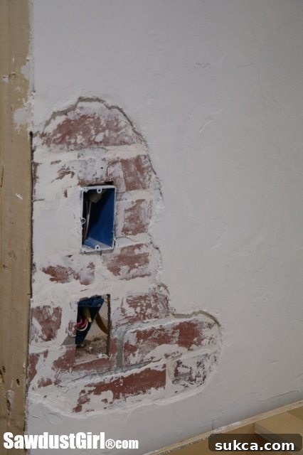 Close-up of the Chipped Plaster Brick Wall with Fixture Considerations