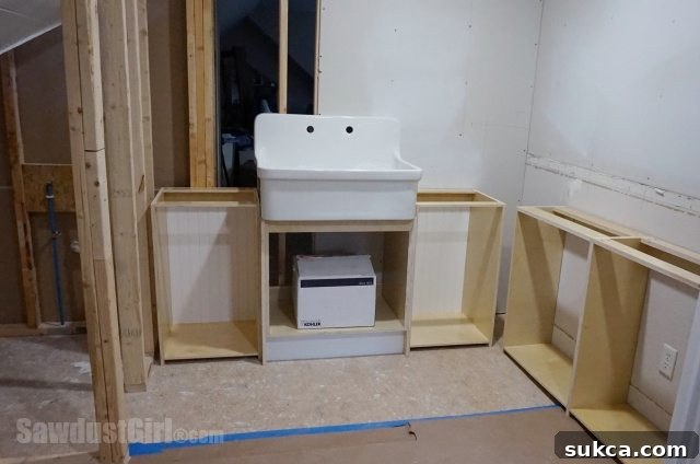 Craft Room Utility Sink Placement Craft room utility sink positioned centrally with a countertop along the side wall