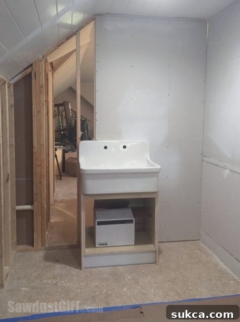 Craft Room Sink Centered Centrally installed utility sink in a craft room providing ample workspace