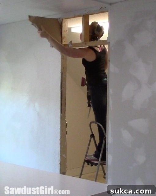 studio recap - The old closet door and frame removed, and the doorway repositioned and re-framed to improve access and functionality.