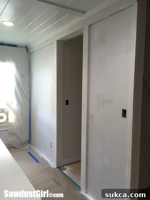 studio recap - A partition wall built inside the HVAC closet to conceal the unit when the door is open, improving aesthetics.