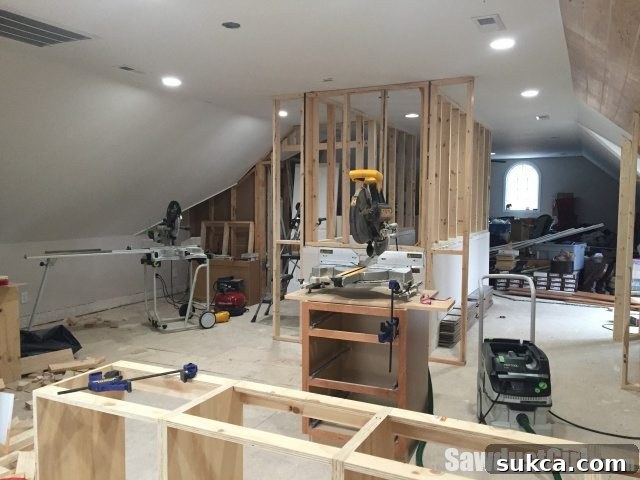 Studio throw back - The extended stairway walls reaching the ceiling, defining space and preparing for vertical storage solutions.