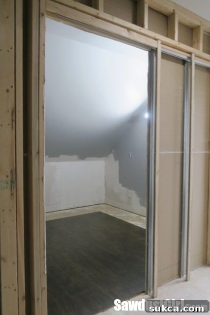 Pergo Laminate Flooring in Recording Studio - The loft repurposed as a personal studio, showing the early installation of Pergo laminate flooring.