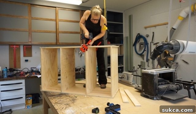 Securing heavy cabinet top by working on table