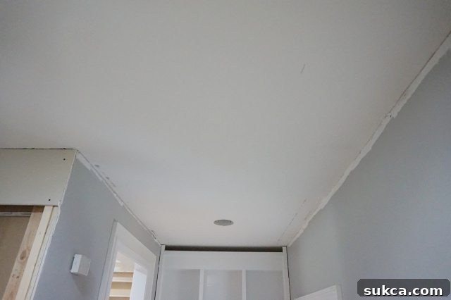Transforming Your Ceiling: Moving Recessed Lights and Drywalling for a Smooth Finish