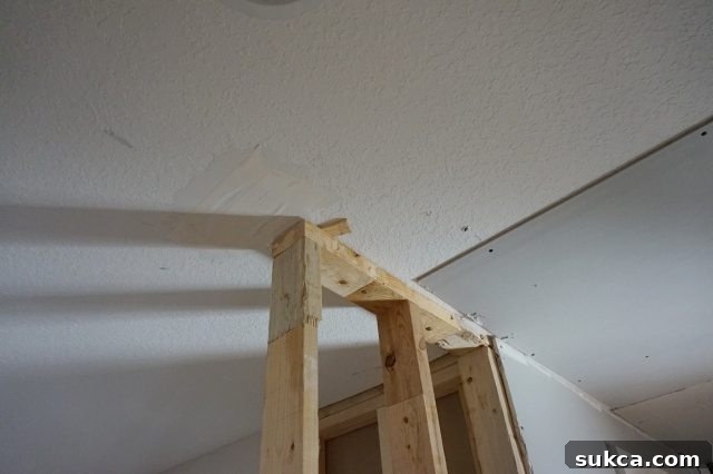 Securing a Partition Wall without Direct Overhead Access