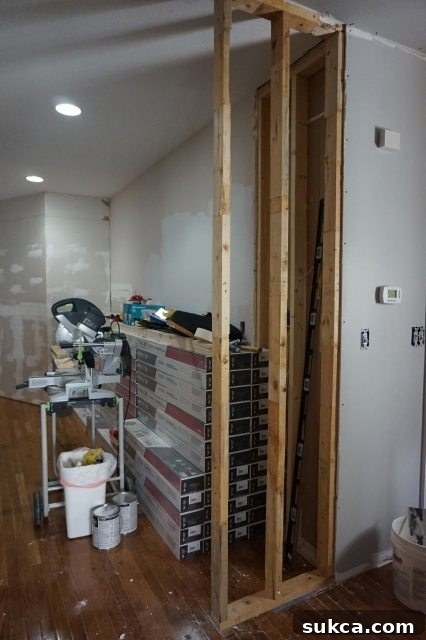 Wall Extension Secured to Adjacent Wall and Floor