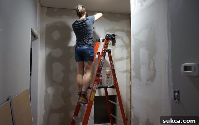 Mudding the New Office Wall for a Smooth Finish