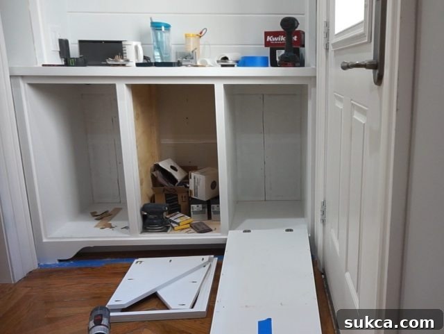 Tilt-out Storage Cabinet Reattaching Holder to Door