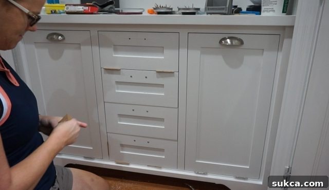 Kitchen Entry Hutch with New Doors and Drawers Completed kitchen hutch with newly installed doors, drawers, and decorative pulls, showcasing the refined look of the custom built-in unit.