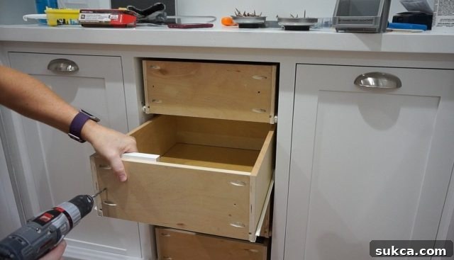 Final Test Fit of Painted Drawer Fronts A series of newly painted drawer fronts test-fitted into the hutch, displaying their perfect alignment and readiness for final hardware installation, underscoring the importance of meticulous planning.